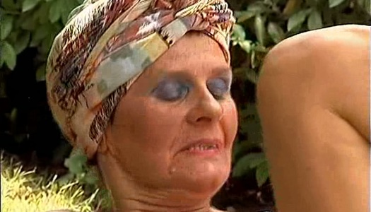 Rapacious old witch Paula rides a cock on the green grass porn pics