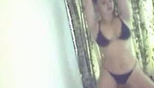 Bootylicious brunette stands near the wall for tickling her fancy at once porn pics