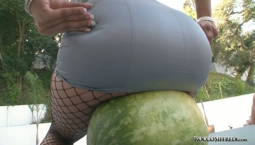 Charming brunette babe smashes watermelon with juicy ass porn pics