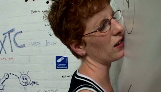 Ugly four eyed woman sucks the dick through the gloryhole porn pics