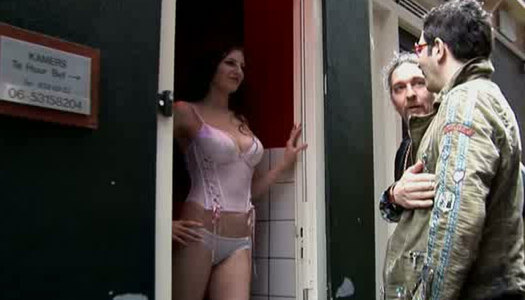 Curvy appetizing slut meets two clients for teasing them in the brothel porn pics