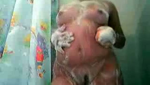 Amateur BBW takes a shower on cam and rubs her soapy pussy passionately porn pics