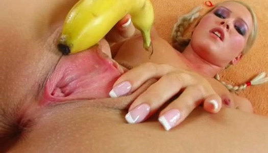 Tasty looking blond milf pokes her ruined cunt with banana porn pics