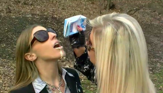 Two wicked sluts in coats get messy and dirty on public in park porn pics