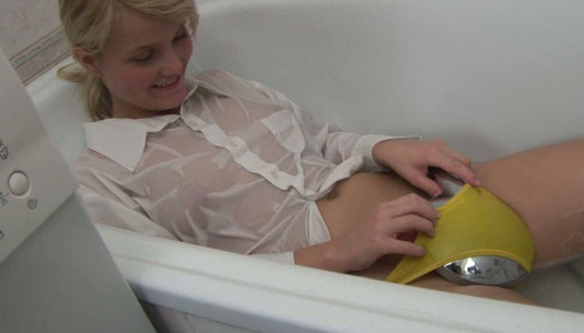 Adorable blond girl Maaike fingers her tight pussy in the bathroom porn pics