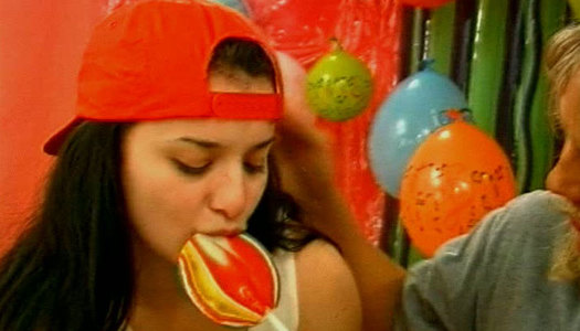 Lustful cute brunette teens switch from sucking a lollipop to giving a blowjob porn pics