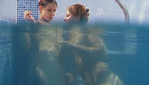 Seductive brunette lesbians tickle their snatches under water in pool porn pics