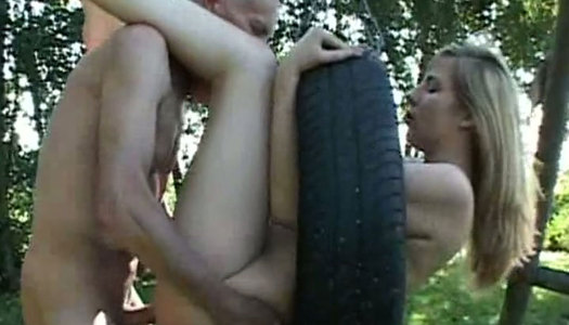 Whorable blondie Danielle gets fucked tough by old Paul on the tire swing porn pics