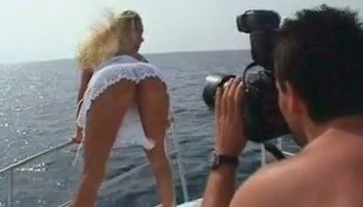 Busty blond babe poses seductively in steamy white dress porn pics