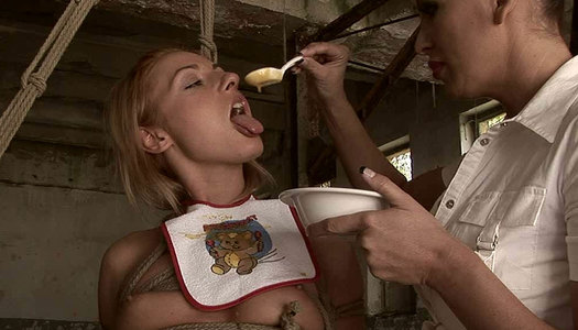 Playful blond cutie gets bandaged and later spoonfed in BDSM sex scene porn pics