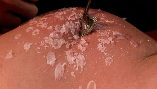 Curvy blond MILF gets her suspended body pinned with spiked metal roller porn pics