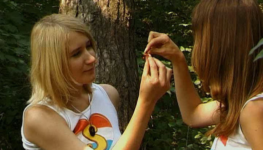Two tempestuous teen chicks have dirty lesbian sex in the forest porn pics