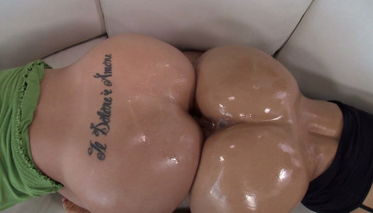 Two sexy round butts get glazed in oil in kinky porn clip porn pics