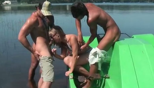 Cute Russian girl is pleasing three horny studs on a boat under the open sky porn pics