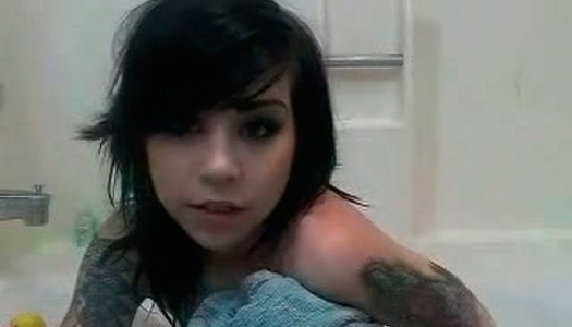 Raven haired emo bitch with tattooes takes dirty shower porn pics