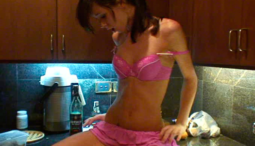 This dark haired bitch with nice ass masturbates in the kitchen porn pics