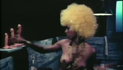 Horny ebony tramp in yellow wig is going to please her kitty with dildos porn pics