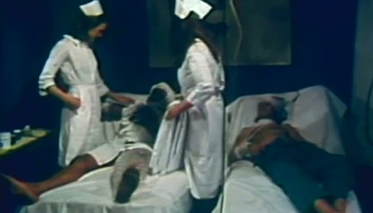 Slutty brunette nurses suck patient's cock and get fucked in hospital porn pics