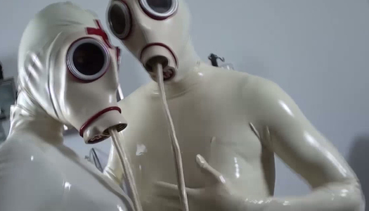 Latex lesbians are pissing on each other porn pics