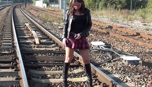 Dirty black haired teen is gonna show hard solo on rail track porn pics