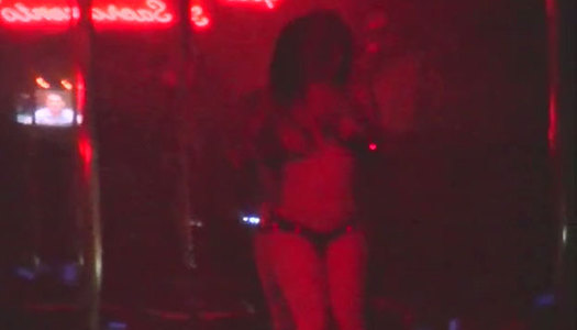 Wanton pole dancer with tattooed  body performs solid solo porn pics