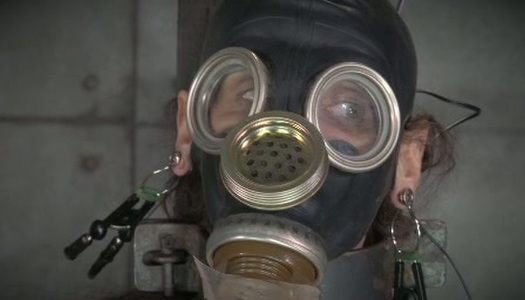 Horny mistress ties her slave to a chair and puts a gas mask on her porn pics