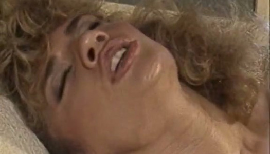 Curly haired vintage lesbian Amber Lynn eats blondie's soaking pussy porn pics