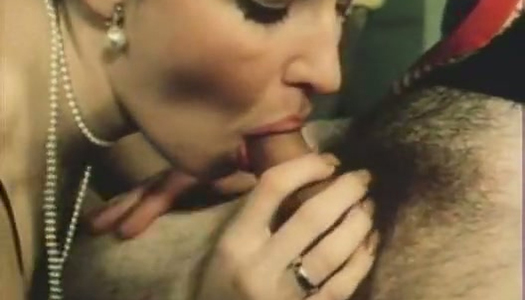 Charming slender vintage brunette in black lingerie gives blowjob porn pics