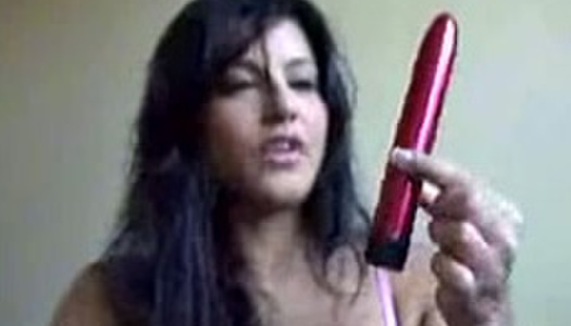 Lewd and hot webcam brunette called Sunny Leone sucks red sex toy porn pics