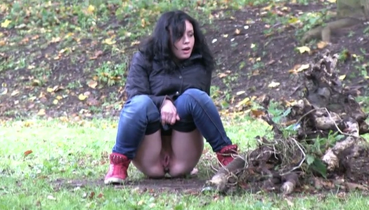 Filthy raven haired bitch goes wild about flashing out in woods porn pics