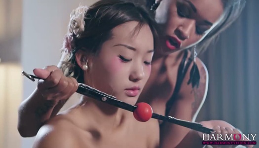 Two lesbians make use of ball gag and strapon to punish Chinese babe Alina Li porn pics