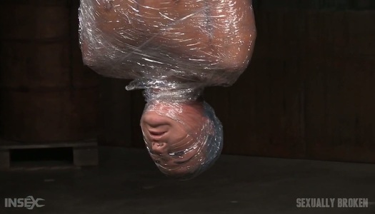 Dude fucks face of suspended  bitch London River covered with plastic warp porn pics