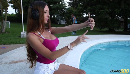 Filthy tranny Veronica Zuluaga takes cumshots on her fake boobies porn pics