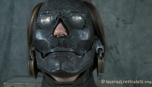 Sexy brunette babe Sister Dee has to wear one of the best metal masks ever made porn pics