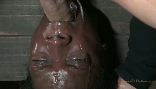 Ugly black chick Ana Foxxx is hung upside down and sucks a cock porn pics
