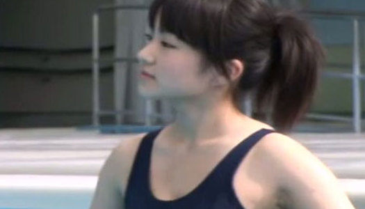 Mesmerizing Japanese cutie Yazapai swims in a pool in sultry bikini porn pics