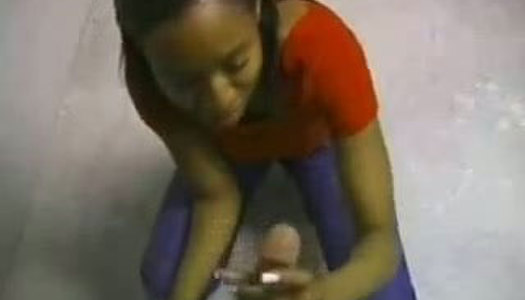 Cheesy black wench gives an awesome handjob porn pics