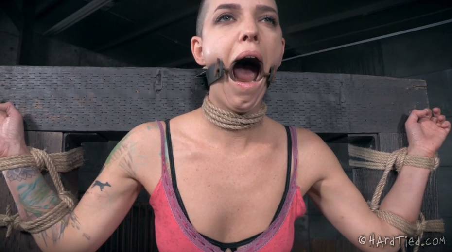 Restrained bald headed gal is punished in the torture room - 2. pic